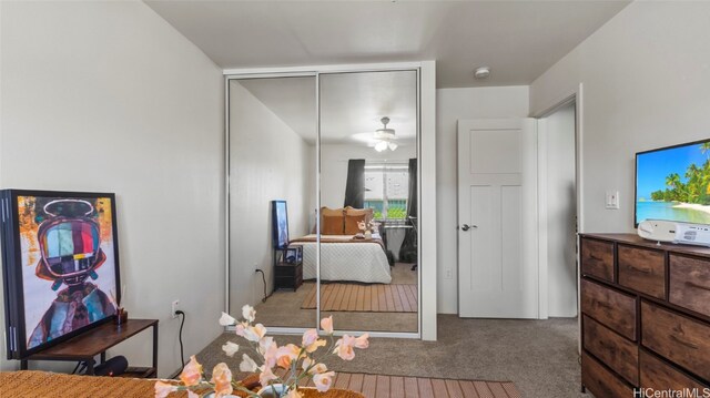 carpeted bedroom with a closet