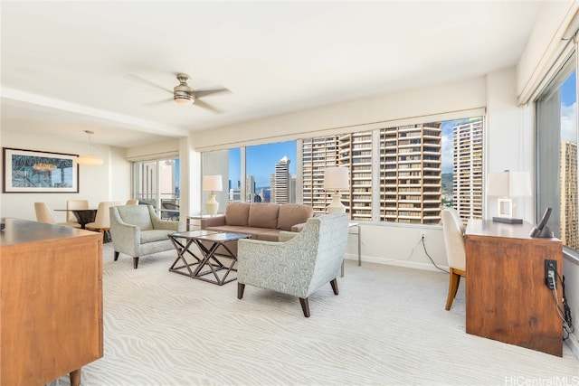 living room featuring ceiling fan and light colored carpet