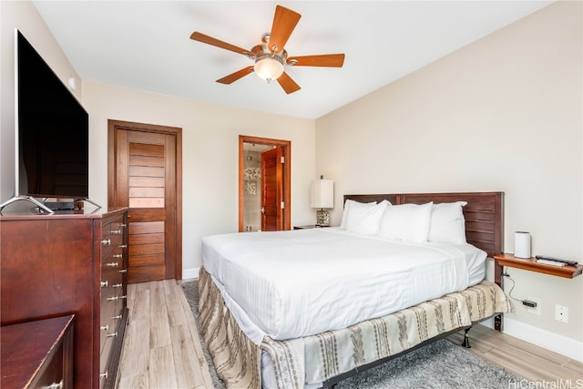 bedroom featuring light hardwood / wood-style floors and ceiling fan