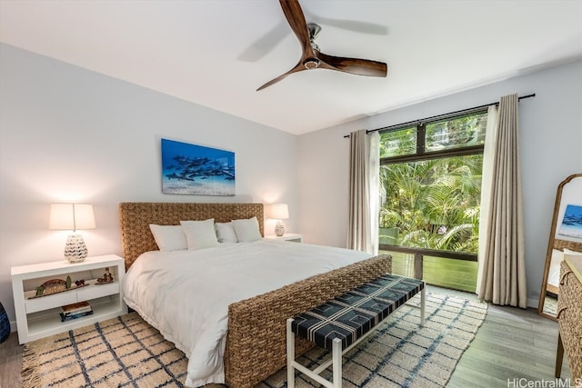 bedroom featuring wood-type flooring and ceiling fan