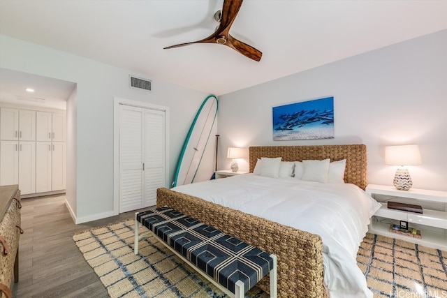 bedroom featuring a closet, ceiling fan, and light hardwood / wood-style flooring