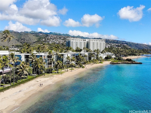 aerial view featuring a water and mountain view and a beach view