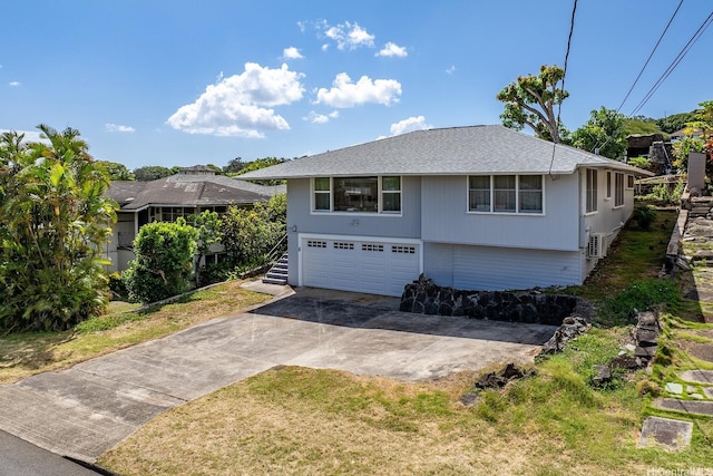 2340 University Ave, Honolulu, HI 96822 - view of front of house featuring concrete driveway, a front yard, a shingled roof, and a garage