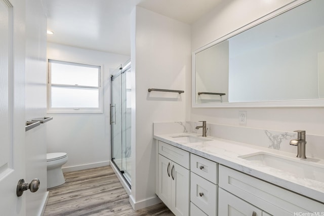 2340 University Ave, Honolulu, HI 96822 - bathroom with a shower stall, toilet, wood finished floors, and a sink