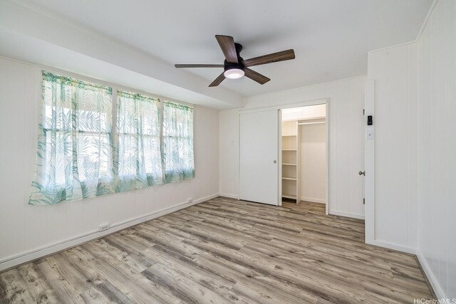 2340 University Ave, Honolulu, HI 96822 - unfurnished bedroom with wood finished floors, a closet, and a ceiling fan