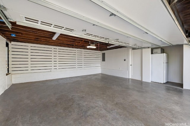 garage with white fridge