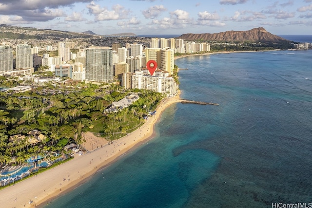 birds eye view of property with a beach view and a water and mountain view