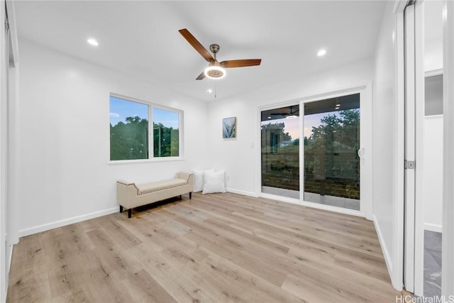 unfurnished room with ceiling fan and light wood-type flooring