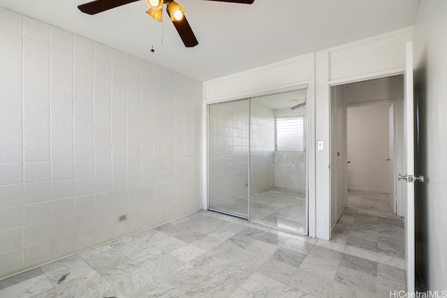 bathroom with a shower and ceiling fan