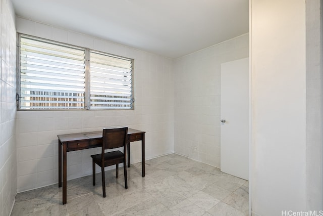 office with tile walls and plenty of natural light