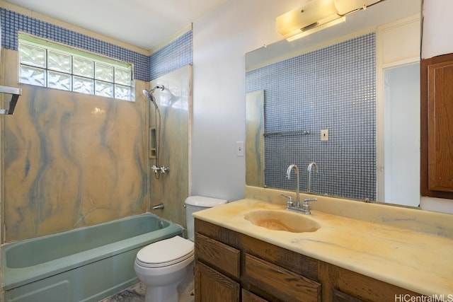 full bathroom featuring vanity, toilet, and tiled shower / bath