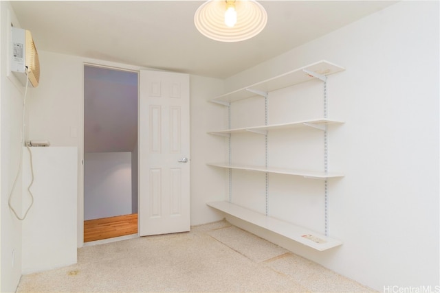 interior space with a wall mounted air conditioner