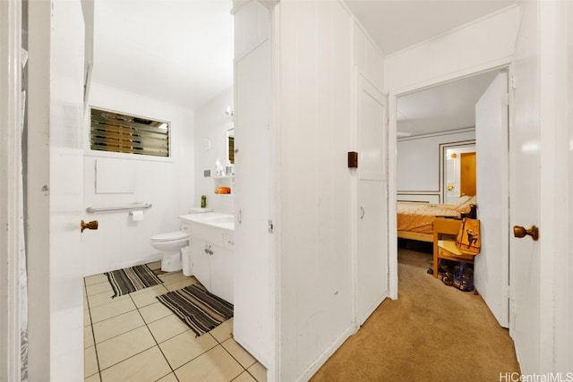 bathroom featuring toilet, vanity, and tile patterned floors