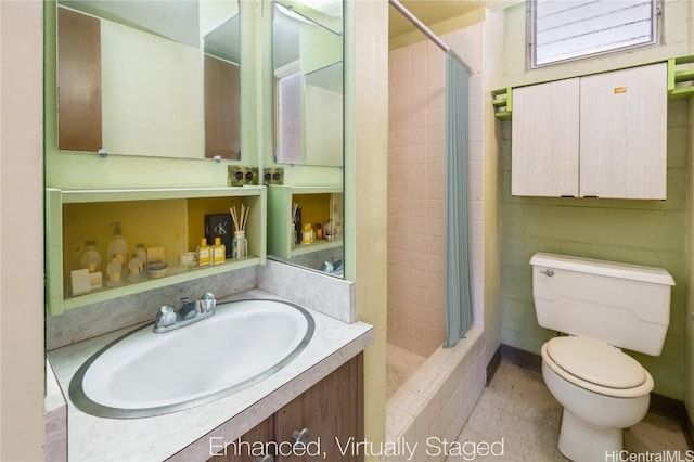 bathroom with a shower with shower curtain, vanity, and toilet