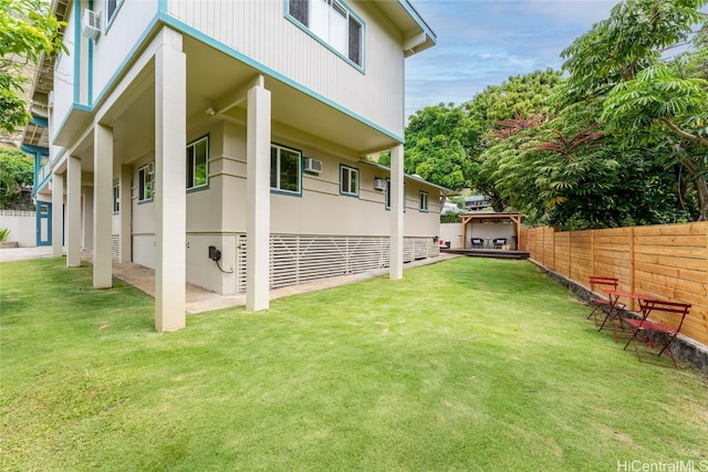 exterior space featuring a wall unit AC