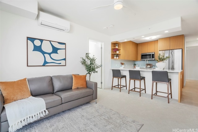 living room featuring light carpet, an AC wall unit, and ceiling fan