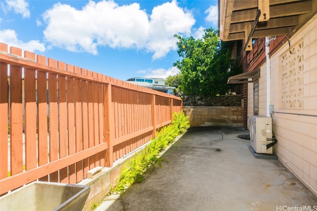 exterior space featuring a patio and ac unit