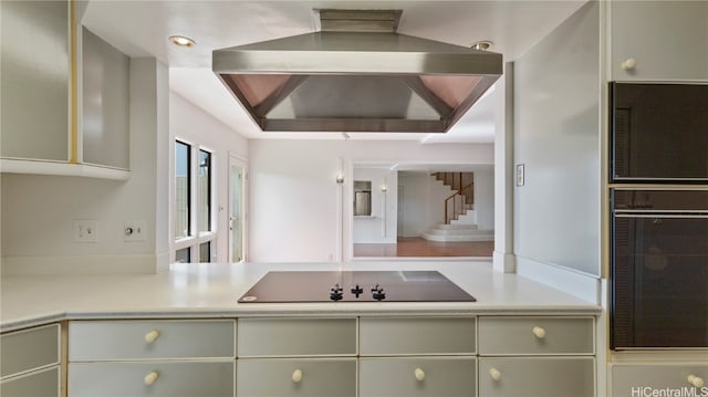 kitchen with extractor fan and black appliances