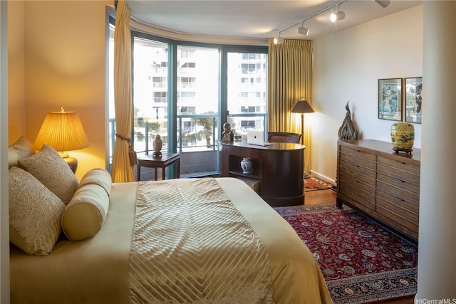 1888 Kalakaua Ave Unit 907, Honolulu, HI 96815 - bedroom with track lighting and wood finished floors