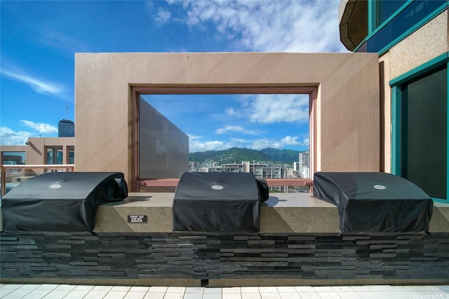 1888 Kalakaua Ave Unit 907, Honolulu, HI 96815 - patio / terrace with exterior kitchen and a mountain view