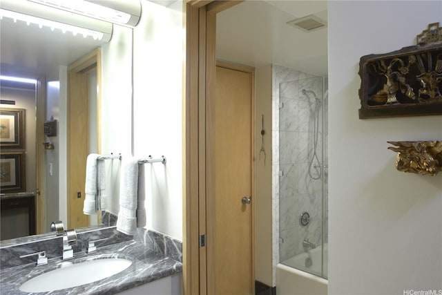 1888 Kalakaua Ave Unit 907, Honolulu, HI 96815 - bathroom with vanity, washtub / shower combination, and a wall mounted AC