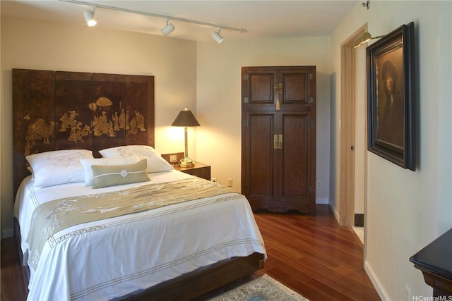 1888 Kalakaua Ave Unit 907, Honolulu, HI 96815 - bedroom with rail lighting and wood finished floors