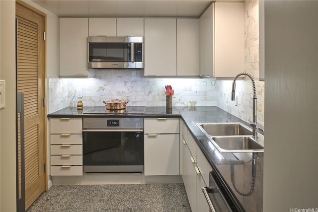 1888 Kalakaua Ave Unit 907, Honolulu, HI 96815 - kitchen with stainless steel appliances, dark countertops, and decorative backsplash