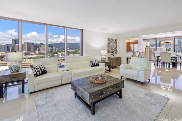 living room featuring expansive windows and light tile patterned floors