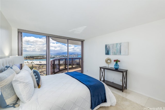 bedroom featuring access to exterior, a wall of windows, a water view, and light tile patterned floors