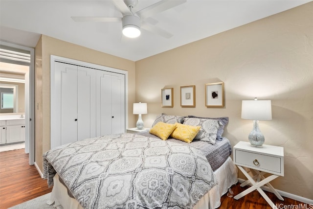 bedroom with a closet, ceiling fan, dark hardwood / wood-style flooring, and ensuite bathroom