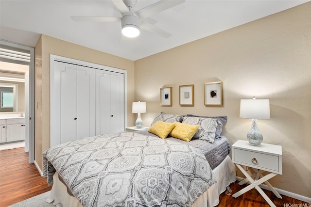 bedroom with baseboards, wood finished floors, a closet, and ceiling fan