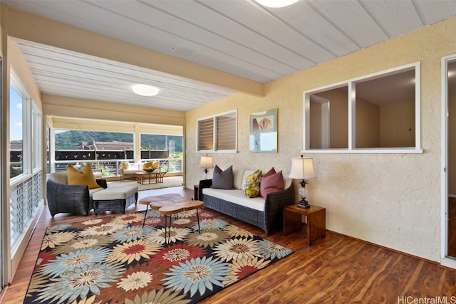 sunroom / solarium with beamed ceiling