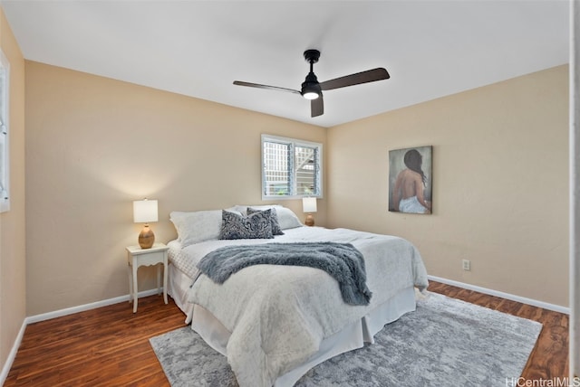 bedroom with dark wood-type flooring and ceiling fan