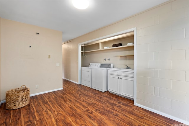 laundry area featuring dark wood-style floors, a sink, electric panel, washer and dryer, and cabinet space