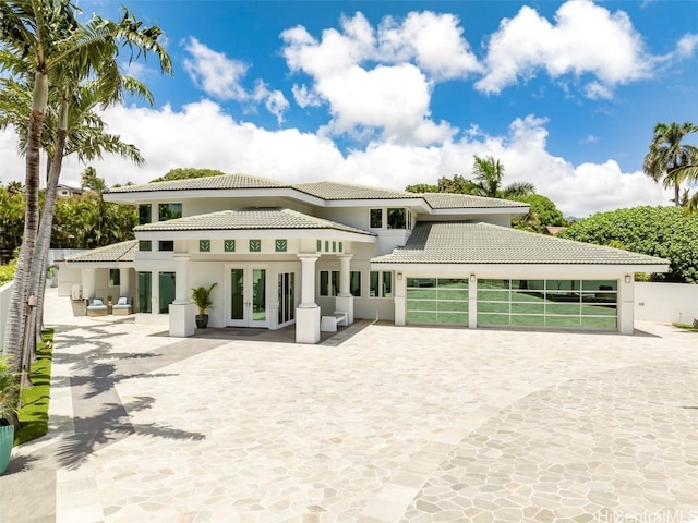 view of front of property featuring a patio area and french doors