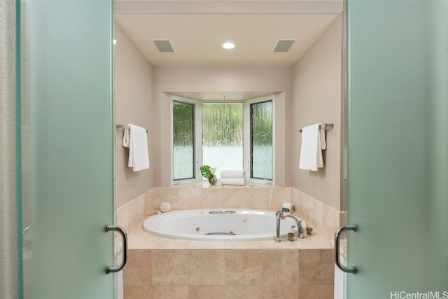 bathroom with tiled bath