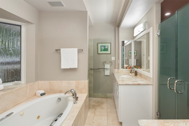 bathroom featuring vanity, independent shower and bath, and tile patterned flooring