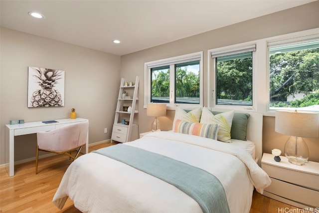 bedroom with hardwood / wood-style floors