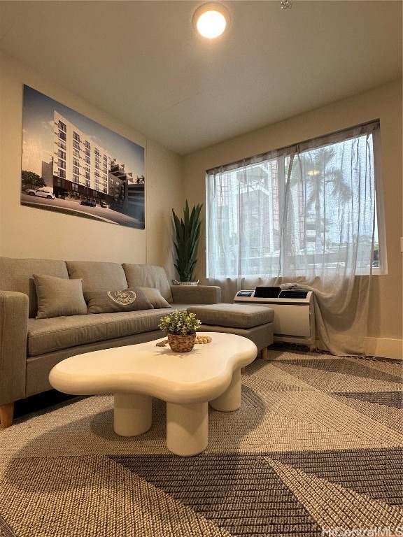 living room with a wealth of natural light and carpet flooring