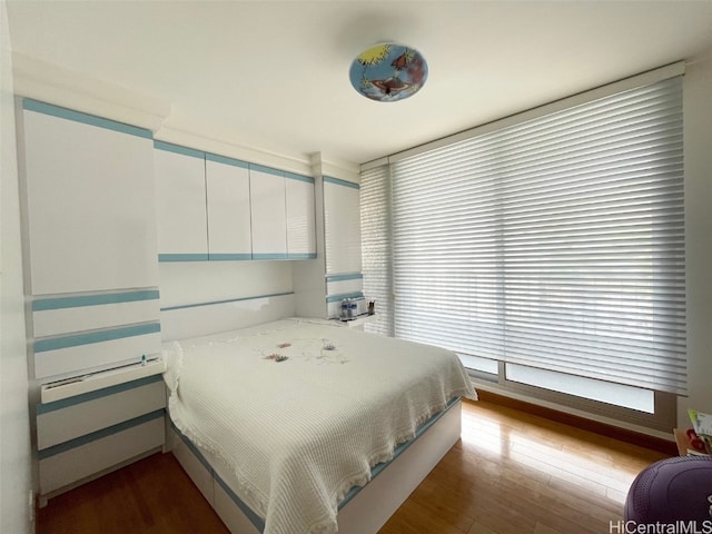 bedroom featuring hardwood / wood-style floors