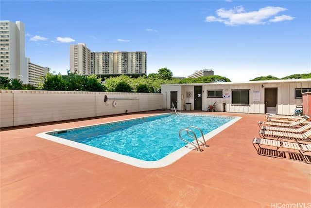 view of swimming pool with a patio