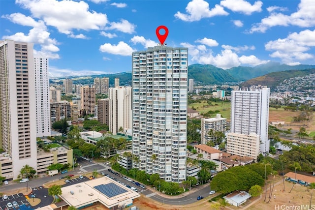 property's view of city with a mountain view