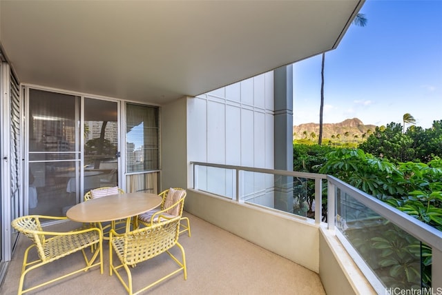 balcony featuring a mountain view