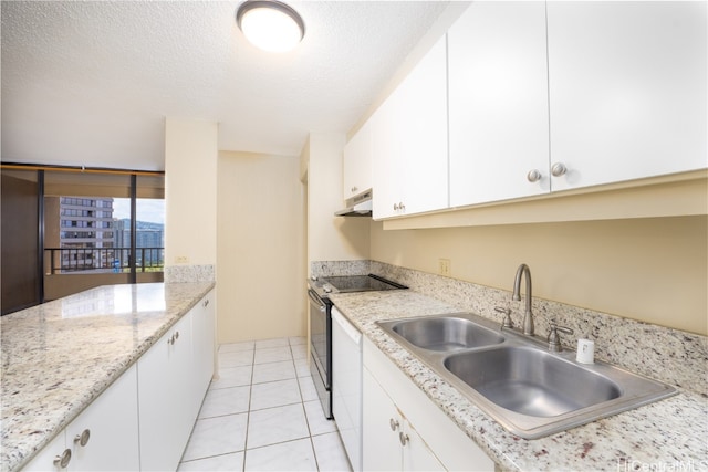 kitchen with sink, stainless steel electric range, light tile patterned floors, white cabinetry, and a textured ceiling