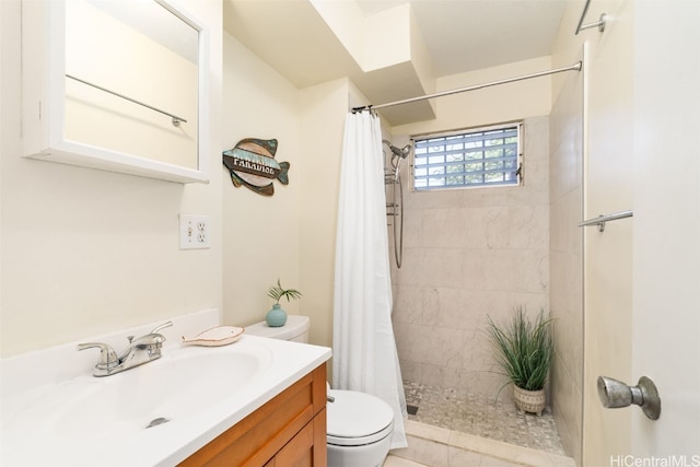 bathroom featuring walk in shower, vanity, and toilet