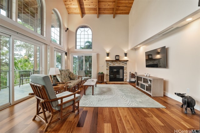 living room featuring hardwood / wood-style flooring, high vaulted ceiling, and wooden ceiling