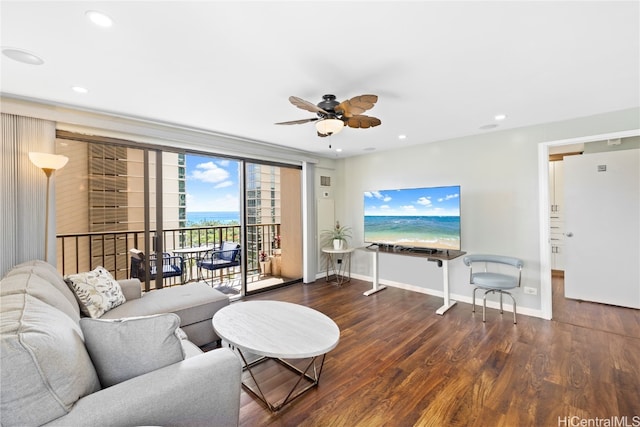 living room featuring ceiling fan and dark hardwood / wood-style flooring