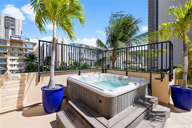 view of patio / terrace featuring an outdoor hot tub