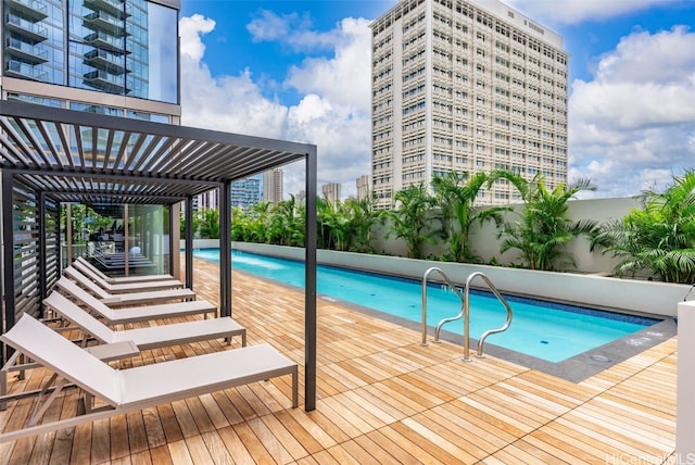 view of swimming pool featuring a pergola