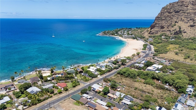 bird's eye view featuring a view of the beach and a water view